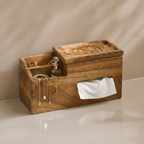 Wooden jewelry organizer with necklaces, bracelets, and a perfume bottle on a neutral background